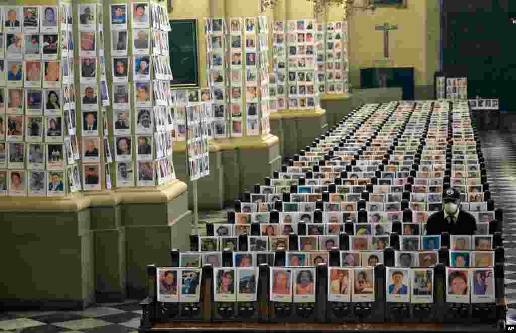 Portraits of people who died of the COVID-19, are seen inside the Cathedral, in Lima, Peru, June 13, 2020.
