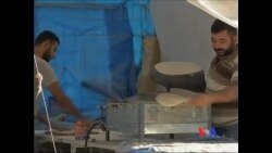 看天下: 帐篷杂货店：难民营的“正常”生活