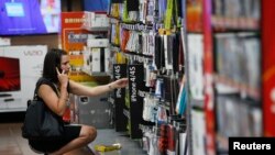 A woman shops at a Walmart Supercenter in Rogers, Arkansas, June 6, 2013. 