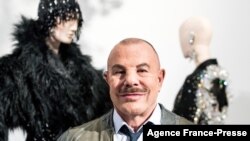 FILE - French fashion designer Thierry Mugler poses for a photo during the presentation of his exhibition "Couturissime" at the Montreal Museum of Fine Arts, in Montreal, Canada, Feb. 26, 2019.