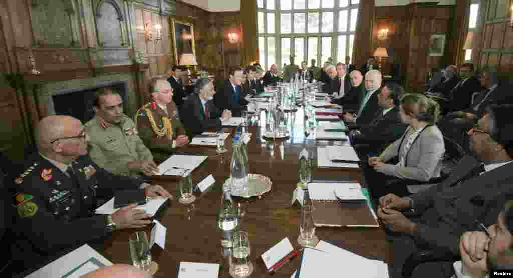 Britain's Prime Minister David Cameron chairs a meeting with Pakistan's President Asif Ali Zardari and Afghan President Hamid Karzai, at Cameron's country residence, Chequers, west of London, February 4, 2013.