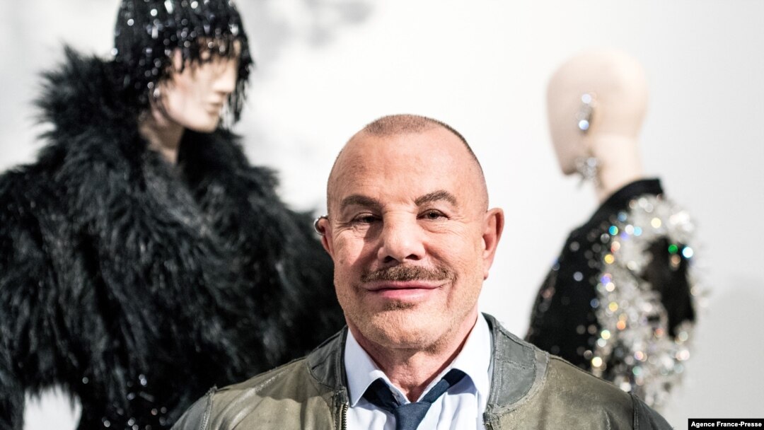 FILE - French fashion designer Thierry Mugler poses for a photo during the presentation of his exhibition "Couturissime" at the Montreal Museum of Fine Arts, in Montreal, Canada, Feb. 26, 2019.