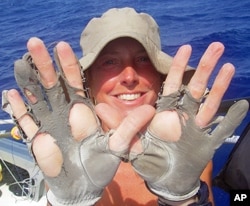 Savage says she goes through about five pairs of rowing gloves during each ocean crossing