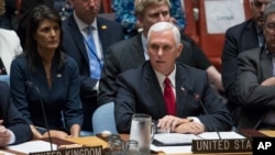 U.S. Vice President Mike Pence speaks during a high level Security Council meeting on United Nations peacekeeping operations, at U.N. headquarters, in New York, Sept. 20, 2017, as U.S. Ambassador to the U.N. Nikki Haley looks on. 