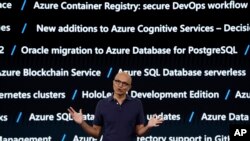 FILE - With a background screen showing new services for Microsoft's Azure cloud computing platform, CEO Satya Nadella delivers the keynote address at Build, the company's annual conference for software developers, May 6, 2019, Seattle, Washington. 
