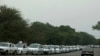 Taxicabs line up to fuel up near San Antonio, Venezuela, Feb. 21, 2019.