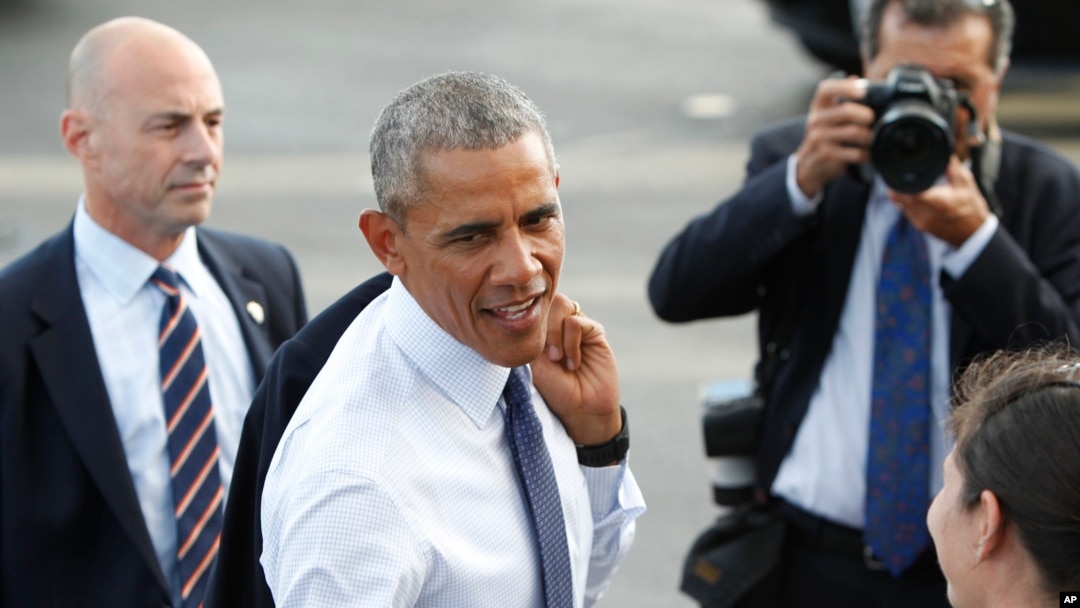 FILE - U.S. President Barack Obama greets military personnel after he arrives on Air Force One at Joint Base Pearl Harbor-Hickam, Wednesday, Aug. 31, 2016.