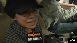 諾貝爾和平獎得主劉曉波的妻子劉霞離開法庭時向媒體哭訴不能接受判決，稱是一種迫害。(視頻截圖)
