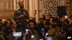 Abu Mohammed al-Golani speaks at the Umayyad Mosque in Damascus, Dec. 8, 2024.