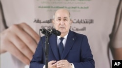 FILE - Algerian president Abdelmajid Tebboune speaks after casting his ballot inside a polling station during the presidential elections, Sept. 7, 2024, in Algiers, Algeria. 