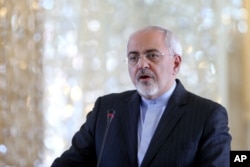 FILE - Iranian Foreign Minister Mohammad Javad Zarif. Asylum seekers who try to reach Australia by boat are sent to migrant camps in the South Pacific.