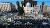 People gather for a rally called for by Syrian activists and civil society representatives "to mourn for the civilian and security personnel casualties", at al-Marjeh square in Damascus on March 9, 2025. 