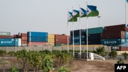 FILE - Djibouti's national flags fly at the Doraleh Container Terminal in Djibouti, July 4, 2018. 