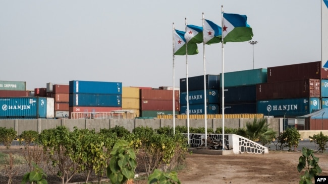 FILE - Djibouti's national flags fly at the Doraleh Container Terminal in Djibouti, July 4, 2018. 