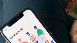 French Digital Affairs junior minister Cedric O demonstrates how to use the French app StopCovid in Paris, May 29, 2020. (AP Photo/Masha Macpherson)