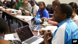 FILE - In this September 2015 photo provided by Botswana-Harvard Partnership, Dr. Sikhulile Moyo, virologist at the Botswana Harvard AIDS Institute Partnership, speaks in Botswana.