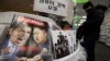 FILE - A magazine with caricatures of President Barack Obama and North Korean leader Kim Jong Un is displayed at a bookstore in Seoul, South Korea, Jan. 3, 2015.