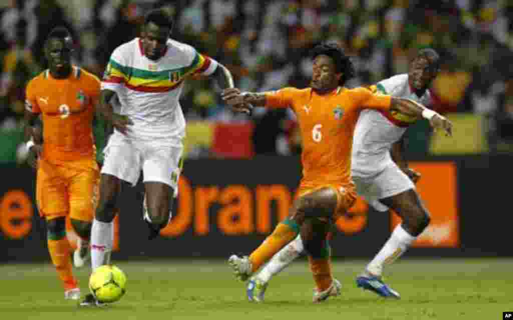 Mali's Cheick Diabate (9) plays against Ivory Coast's Jean-Jacques Gosso (6) during their African Nations Cup semi-final soccer match at the Stade De L'Amitie Stadium in Gabon's capital Libreville February 8, 2012.