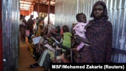 FILE — A handout photograph, shot in January 2024, shows a woman and baby at the Zamzam displacement camp, close to El Fasher in North Darfur, Sudan. (MSF via Reuters)