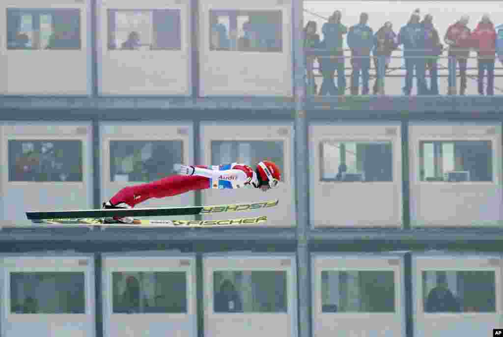 Germany&#39;s Eric Frenzel flies through the air during the ski jumping portion of the Nordic Combined, at the Nordic Ski World Championships in Innsbruck, Austria.