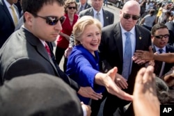 Democratic presidential candidate Hillary Clinton greets people outside an early voting center in Lauderhill, Fla., Nov. 2, 2016.