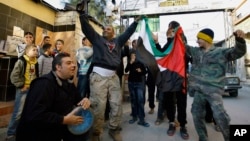 Palestinians dance after hearing that Ariel Sharon, the hard-charging Israeli general and prime minister, died, as they celebrate in the Ein el-Hilweh camp near the southern city of Sidon, Lebanon, Jan. 11, 2014