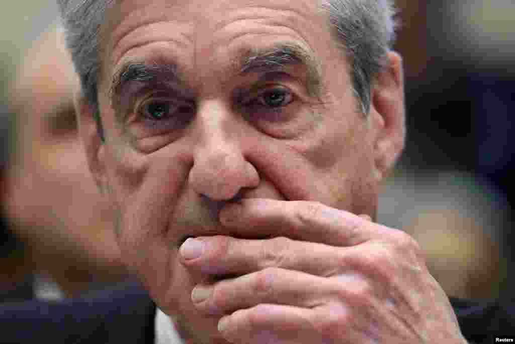 Former Special Counsel Robert Mueller refers to documents as he testifies before a US House Judiciary Committee hearing on the Office of Special Counsel&#39;s investigation into Russian meddling in the 2016 US Presidential Election, Capitol Hill, Washington.