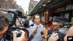 Rep. Anthony Weiner, 46-year-old congressman from New York, is questioned by the media near his home in the Queens borough of New York City, June 11, 2011