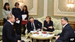 Путін, Олланд, Меркель і Порошенко у Мінську 11 лютого 2015 р.