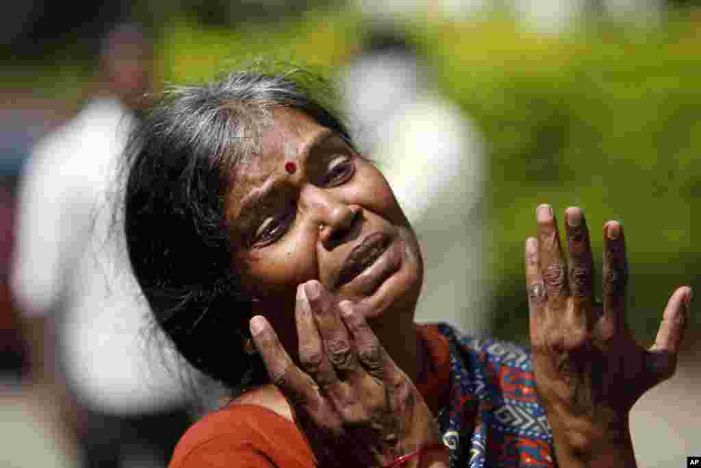 Sarala, mother of Raghuveer who was killed in a bus fire accident in India, weeps outside the mortuary of Osmania General Hospital in Hyderabad. 