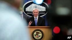 FILE - Then-Deputy Attorney General Jeffrey Rosen holds a news conference at the Justice Department in Washington, Oct. 21, 2020.