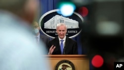 FILE - Then-Deputy Attorney General Jeffrey Rosen holds a news conference at the Justice Department in Washington, Oct. 21, 2020.