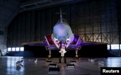 FILE - A Lockheed Martin F-35 Lightning II fighter jet is seen in its hangar at Patuxent River Naval Air Station, in Maryland, Oct. 28, 2015.