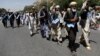 FILE - Afghan peace marchers arrive in Kabul, Afghanistan, June 18, 2018.