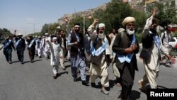 FILE - Afghan peace marchers arrive in Kabul, Afghanistan, June 18, 2018.