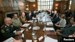 Britains PM Cameron (5th L) chairs a meeting with Pakistan's President Zardari (4th R) and Afghan President Karzai (6th R), at Cameron's country residence, Chequers, in Buckinghamshire, February 4, 2013 file photo.