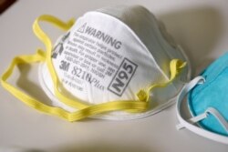 FILE PHOTO: Various N95 respiration masks at a laboratory of 3M, in Maplewood, Minnesota, U.S. REUTERS/Nicholas Pfosi/File Photo