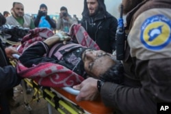 An injured Syrian arrives at a refugee camp in Rashidin, near Idlib, Syria, after he was evacuated from Aleppo during a cease-fire, Dec. 20, 2016.