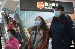 People wear masks at a metro station in Taipei, Taiwan, Tuesday, Jan. 28, 2020.