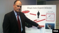 Assistant U.S. Attorney Gilmore Childers outlines the way the international car theft and export ring worked during a press conference in Newark, May 23, 2012. (Adam Phillips/VOA)