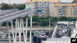 FILE - Cars are blocked on the Morandi Bridge after a section of it collapsed, in Genoa, Italy, Aug. 14, 2018. 