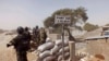 Cameroon soldiers stand guard at a lookout post as they take part in operations against the Islamic extremists group Boko Haram near the village of Fotokol, Feb. 25, 2015.