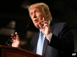 FILE - Republican presidential candidate Donald Trump speaks in Columbus, Ohio, Nov. 23, 2015. President Barack Obama condemned Trump's renewed call for a ban on Muslim immigrants in the wake of the mass shooting in Orlando, Fla.