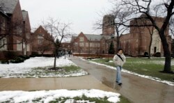 Andy Matusek, 20, a sophmore marketing and logistics major at John Carroll University, walks to classes at the school Thursday, March 2, 2006, in Cleveland. The Jesuit-run school looked to increase its racial diversity and national profile.