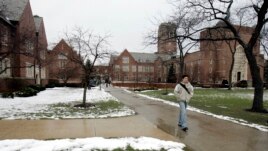 Andy Matusek, 20, a sophmore marketing and logistics major at John Carroll University, walks to classes at the school Thursday, March 2, 2006, in Cleveland. The Jesuit-run school looked to increase its racial diversity and national profile.
