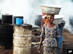 A woman carries fresh produce on her head through the streets of Accra … African farmers don’t have the resources to rapidly transport local food to markets, and so indigenous food types are replaced by imported food in most African supermarkets