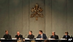 From left, Rev. Hans Zollner, Mons. Charles Scicluna, Cardinal Blase J. Cupich, Vatican Spokesperson Alessandro Gisotti, Rev. Federico Lombardi and Sister Bernadette Reis give a press conference on a Vatican summit on preventing clergy sex abuse, at the Vatican, Feb. 18, 2019.