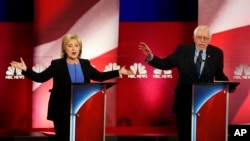 FILE - Democratic presidential candidates Hillary Clinton and Bernie Sanders joust during a campaign debate at the Gaillard Center in Charleston, S.C., Jan. 17, 2016.