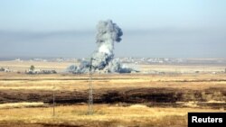 FILE - Smoke rises after airstrikes from the U.S.-led coalition against Islamic State militants in a village east of Mosul, Iraq, May 29, 2016. Kurdish peshmerga forces, backed by U.S.-led airstrikes, have begun an operation, Aug. 14, 2016, to retake villages around Mosul from Islamic State militants.