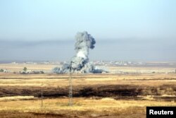 Smoke rises after airstrikes from the U.S.-led coalition against Islamic State militants in a village east of Mosul, Iraq, May 29, 2016.